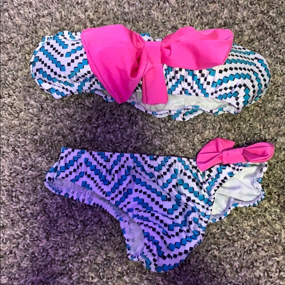 Patterned swimsuit with bow